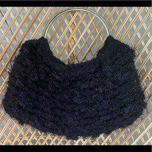 Black knit clutch purse.